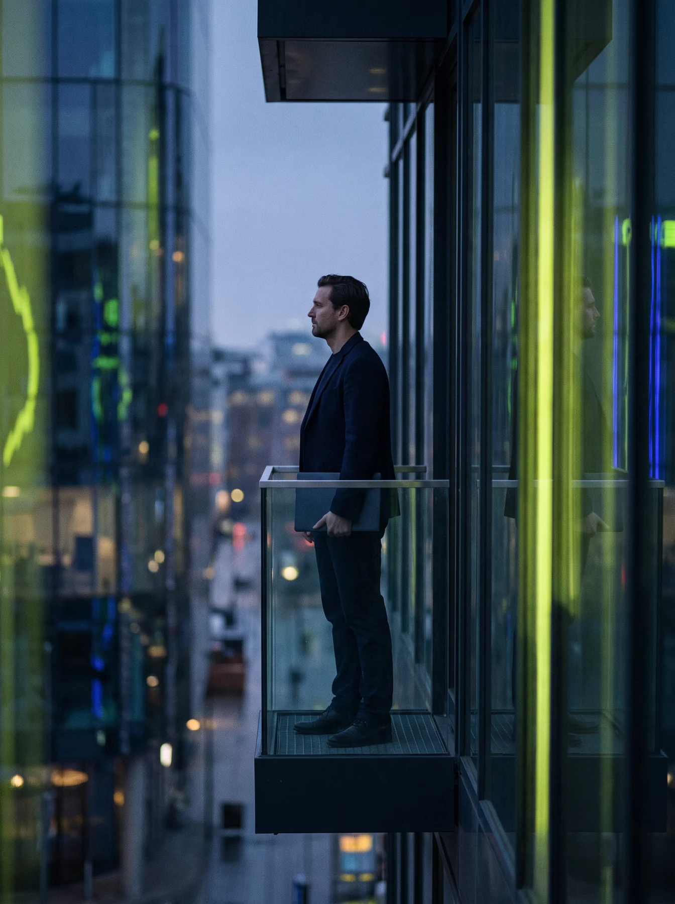 Engineer by a window at dusk